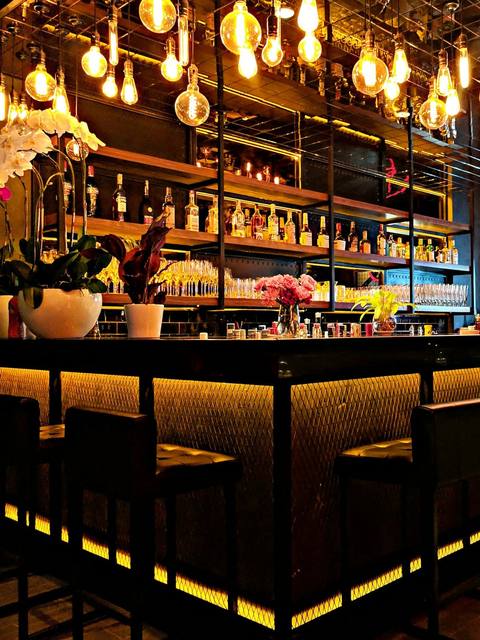 The bar lit up with shelves of whisky