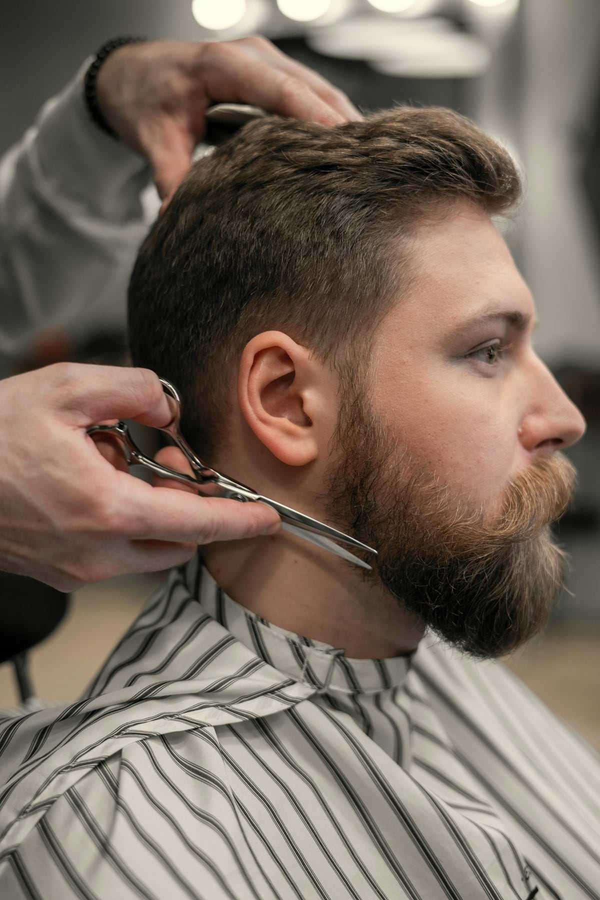 A beard being shaped with scissors