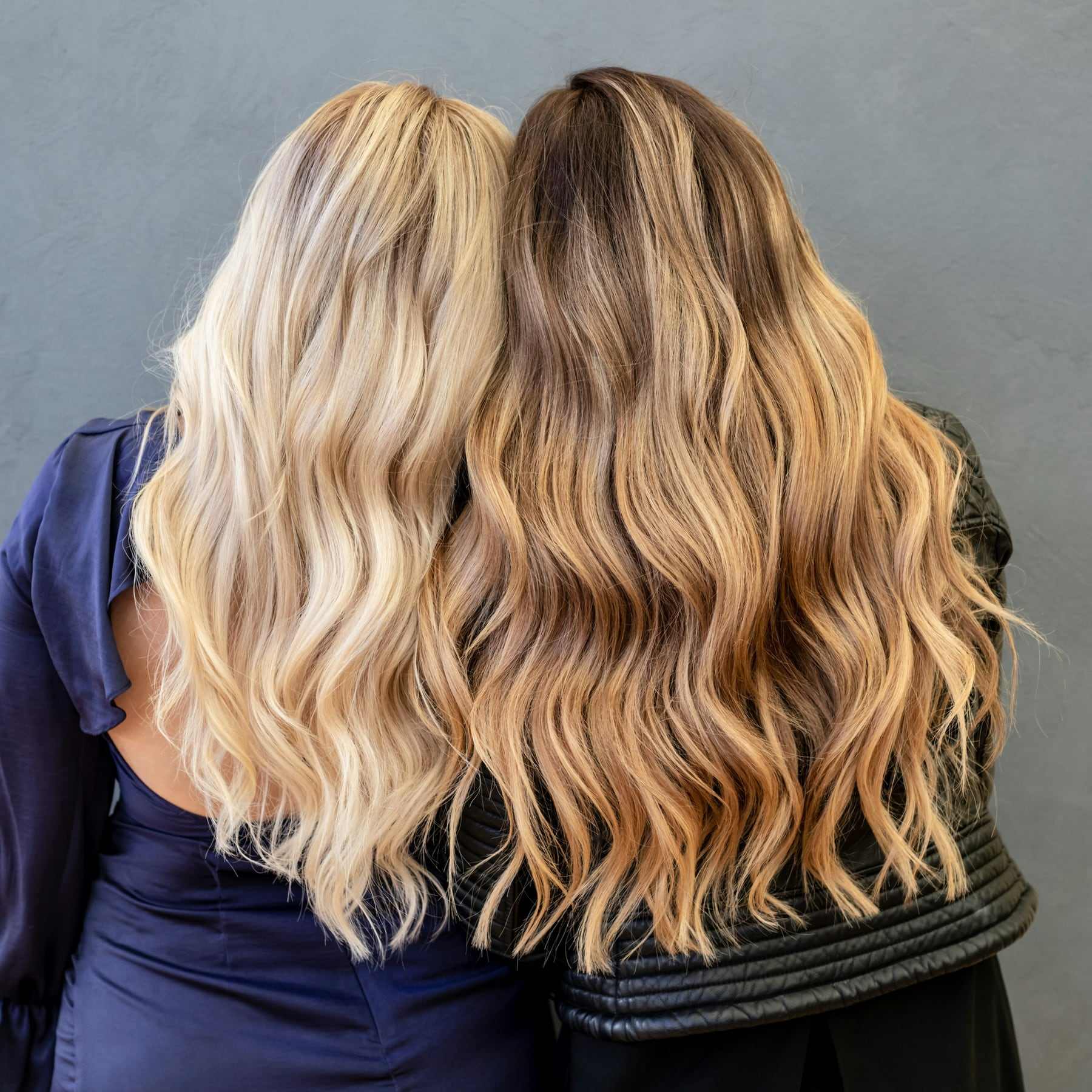 Two heads of soft blonde waves