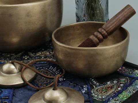Singing bowls and dried lavender on a shelf