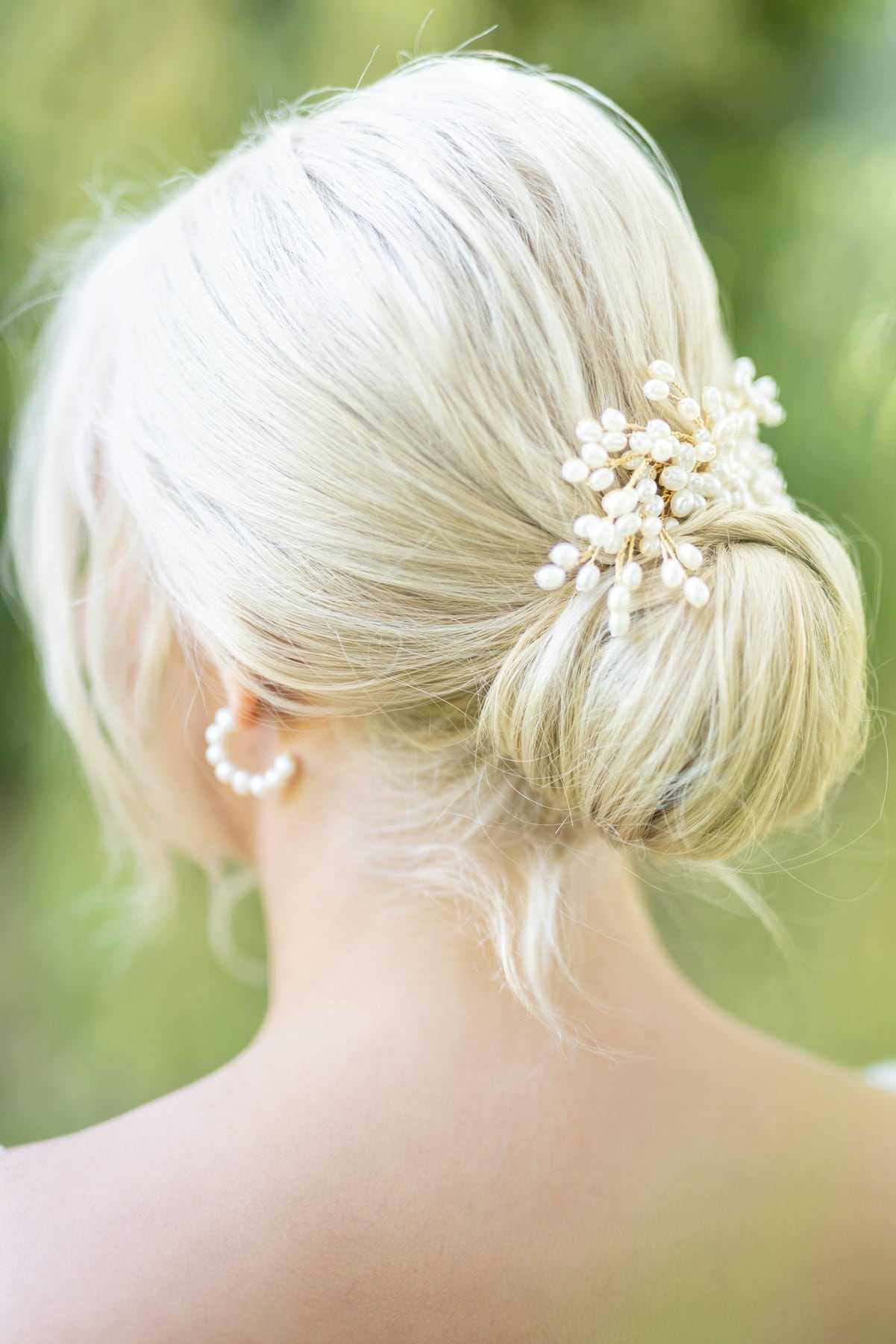 A soft blonde bun scattered with pearls