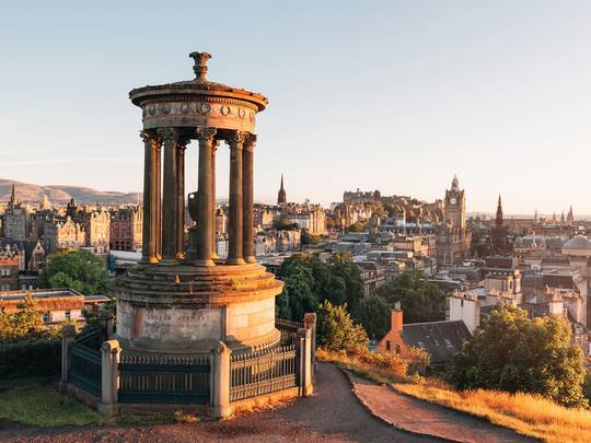 The Dugald Stewart Monument on Calton Hill at sunrise