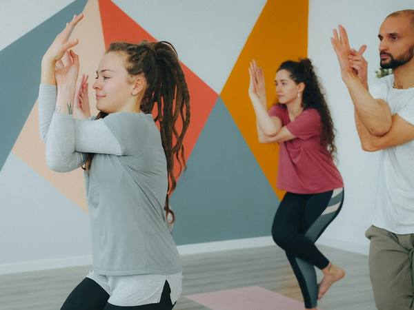 Students practising together in a bright studio