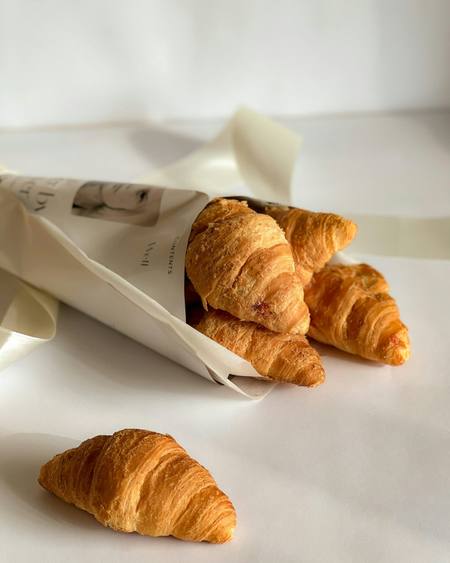 Butter croissants in a paper bag