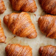 A tray of golden croissants