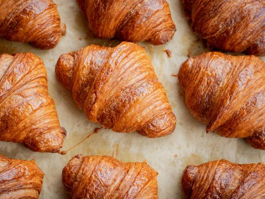 Rows of freshly baked croissants