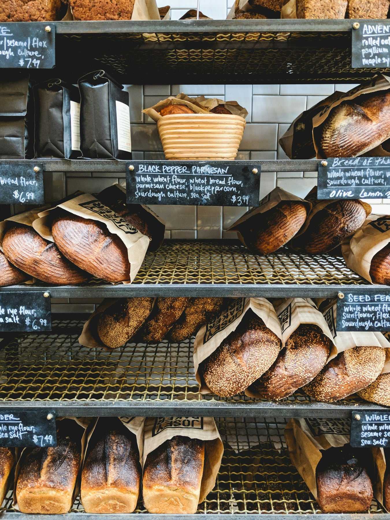 Shelves of loaves with handwritten labels