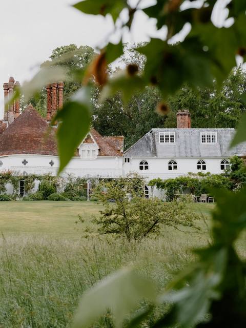 The farmhouse and lawns at Hartwell on a summer evening