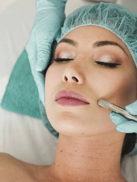 A client receiving a facial treatment