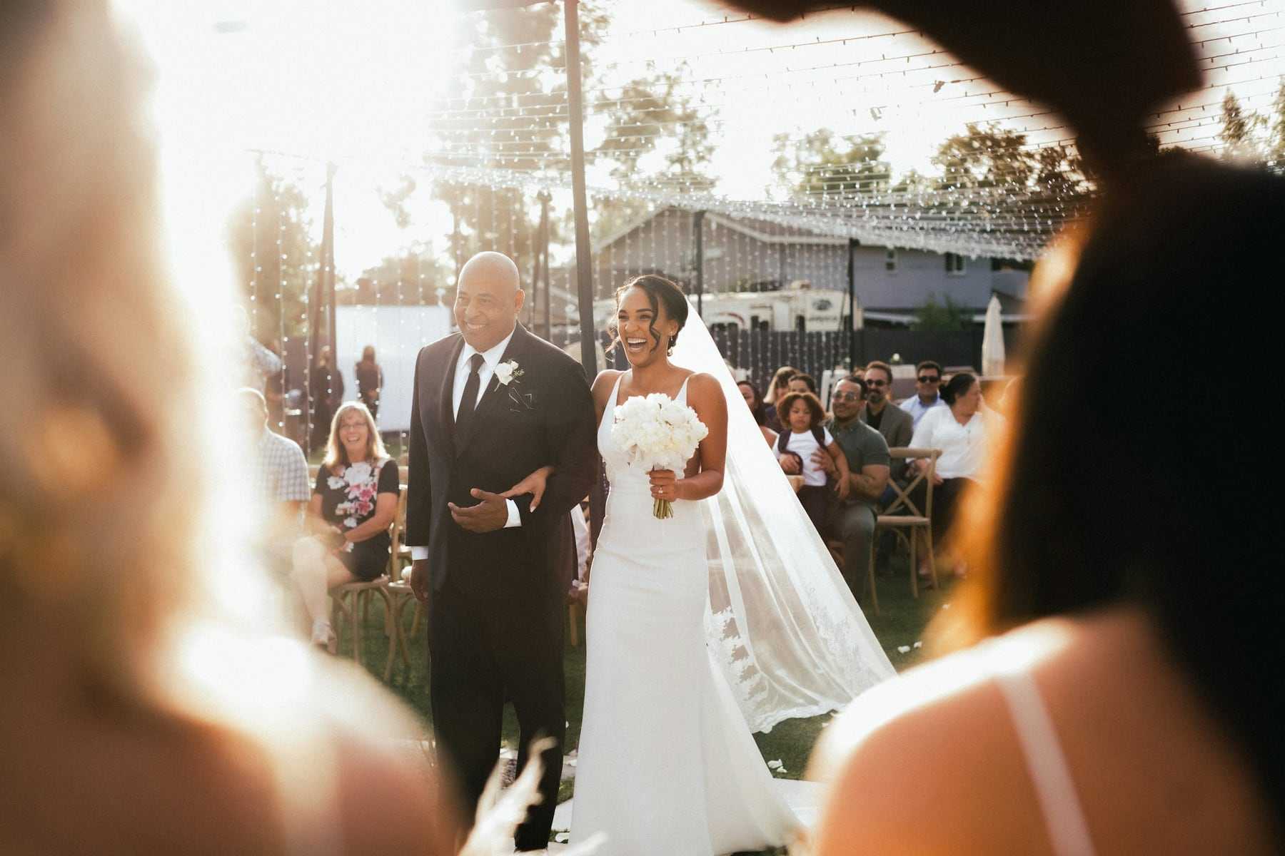 A bride walking down the aisle with her father