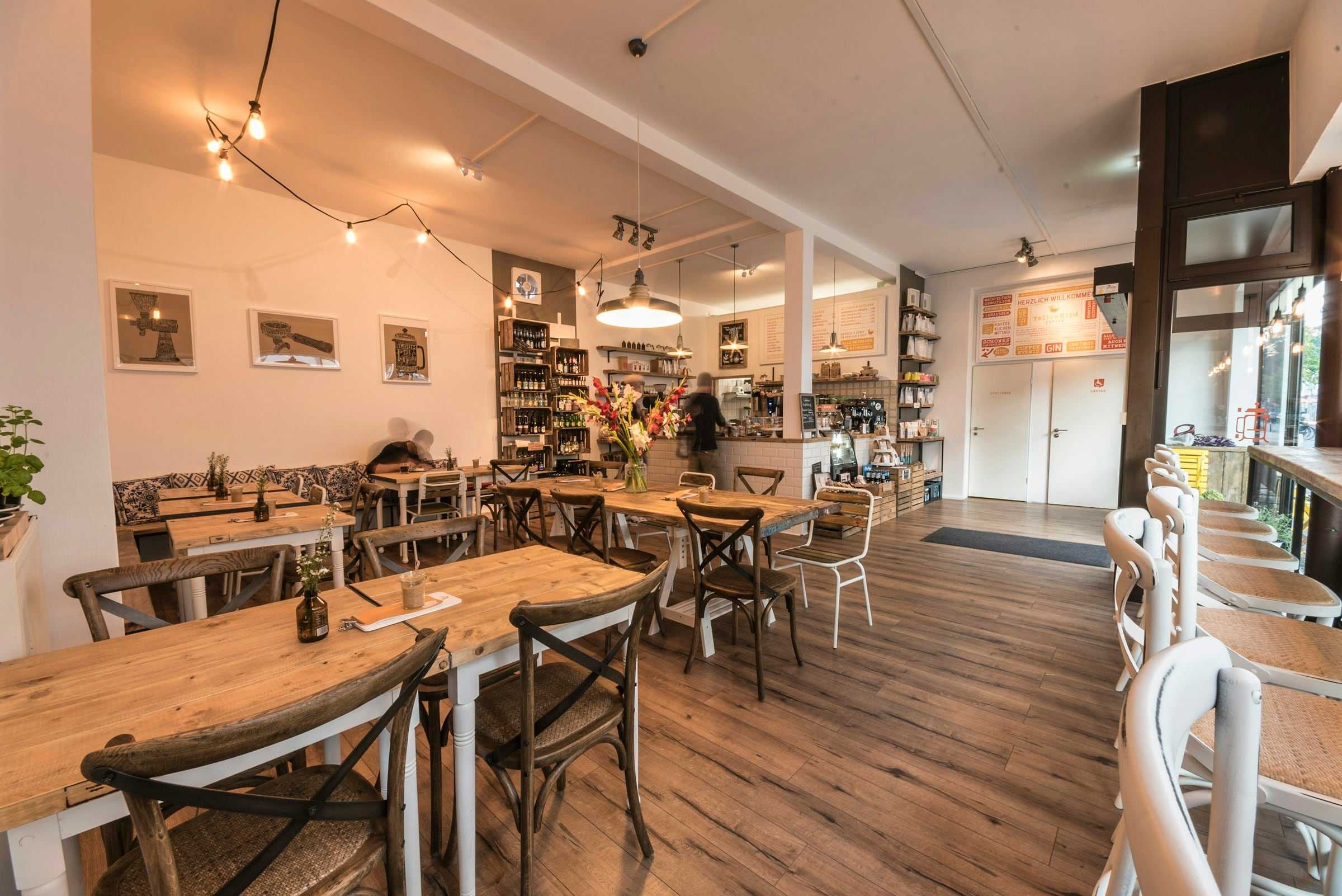 The café with wooden tables and chairs by the window