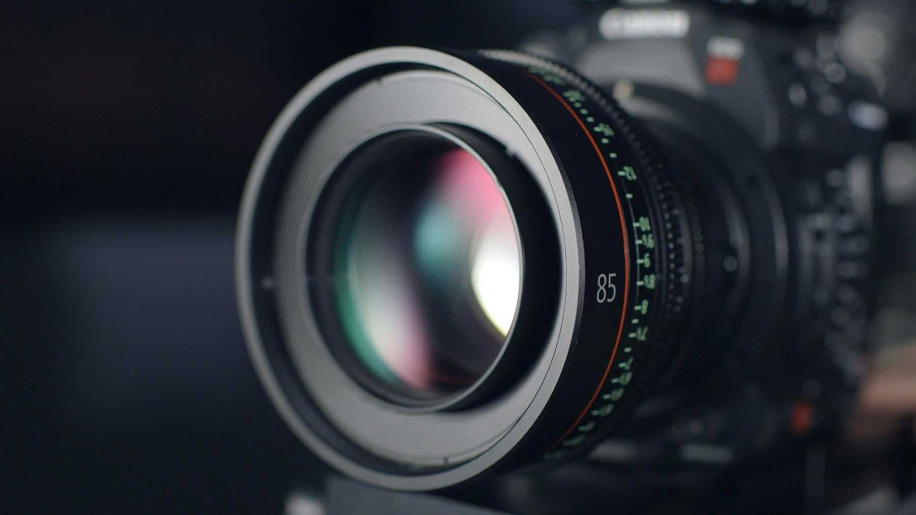 A camera lens on a dark background