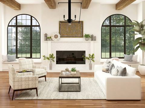 A bright drawing room with arched windows and a fireplace