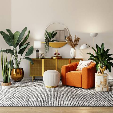 A clean living room with plants and cushions