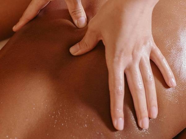 Hands giving a deep tissue massage