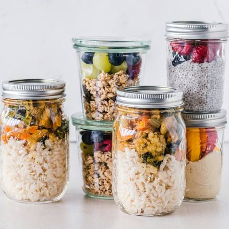 Jars of overnight oats, rice and vegetables ready for the week