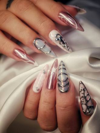 Long stiletto nails with gold and jewelled nail art