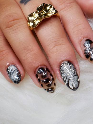 Dark nails with leopard print and gold leaf details