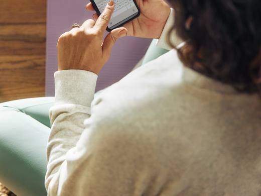 Someone checking a workout plan on their phone