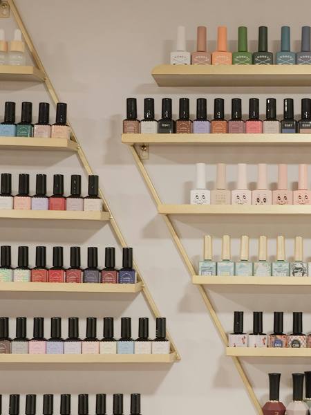 Shelves of nail polish bottles in every colour