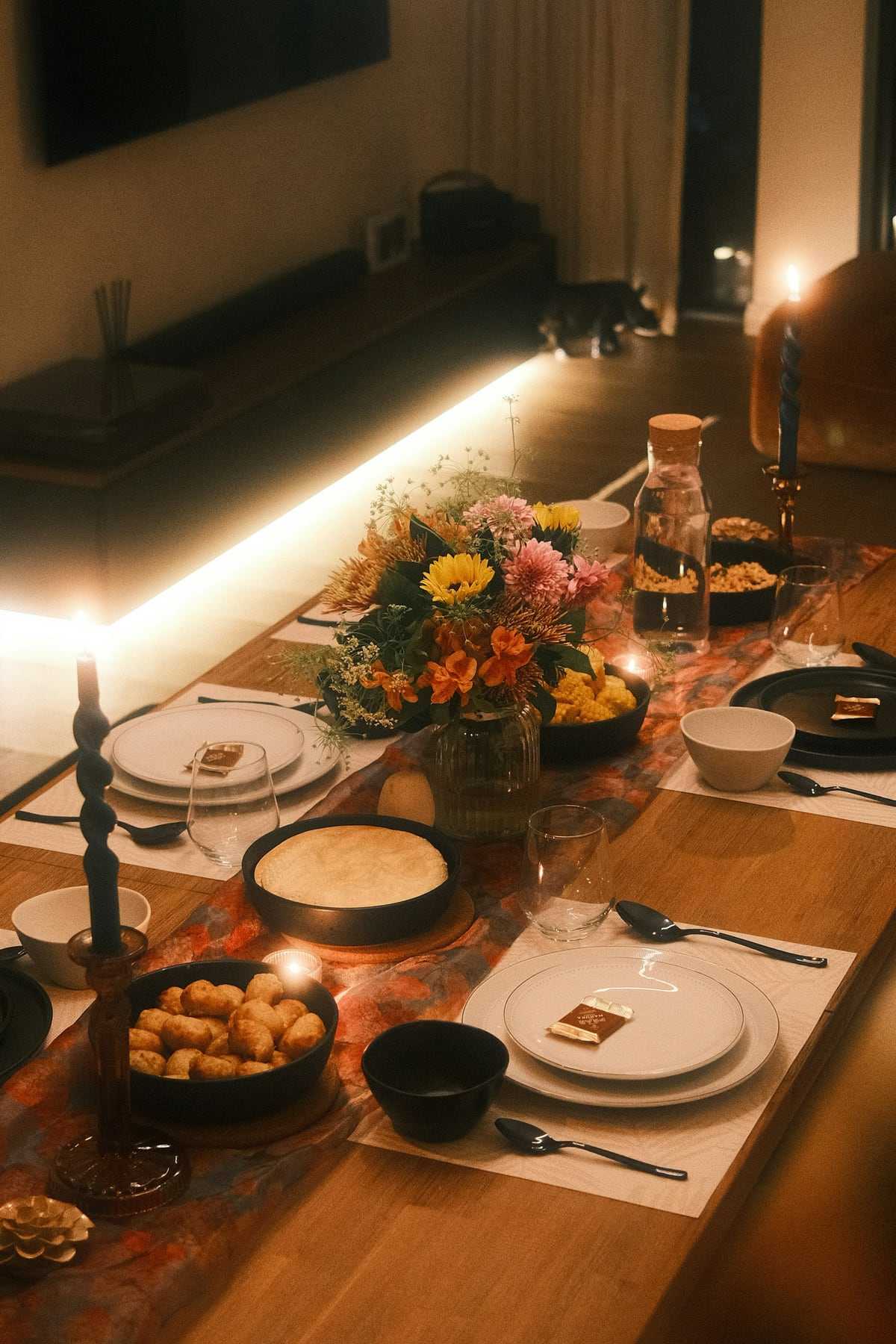 A long table set with candles