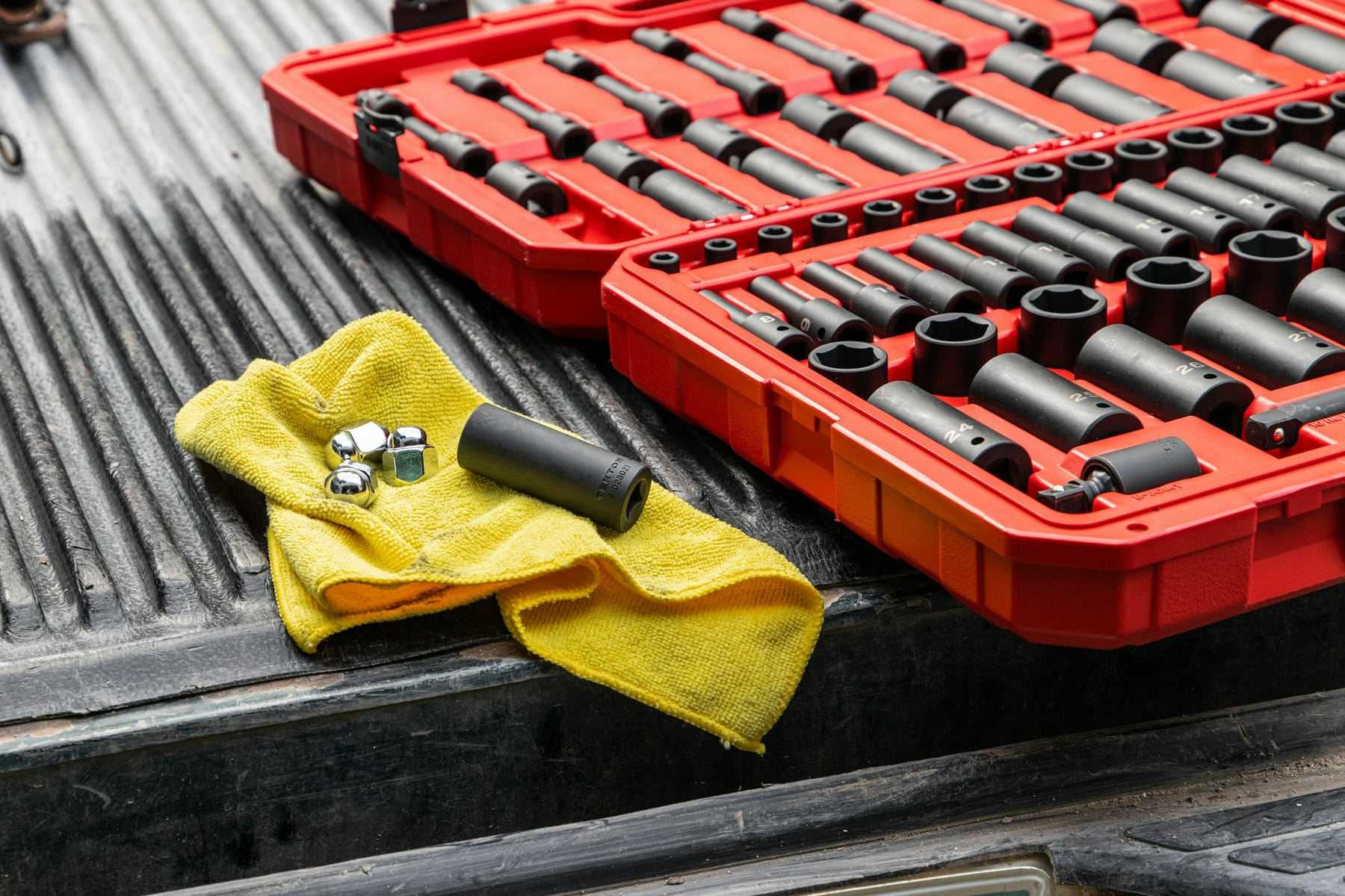 A red socket set and a yellow cloth on the bench