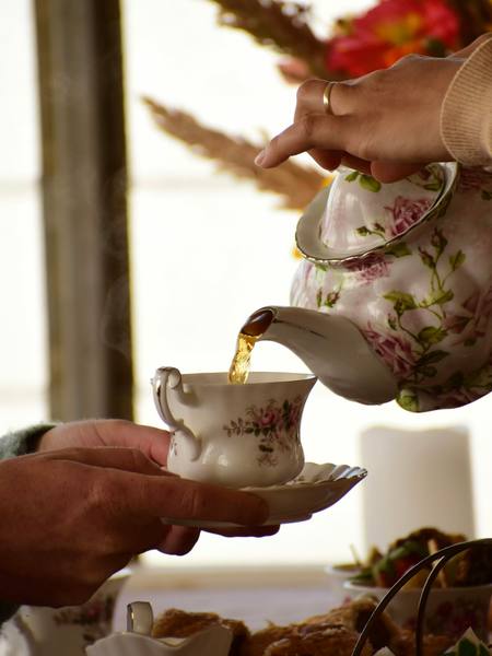 Tea poured from a floral teapot